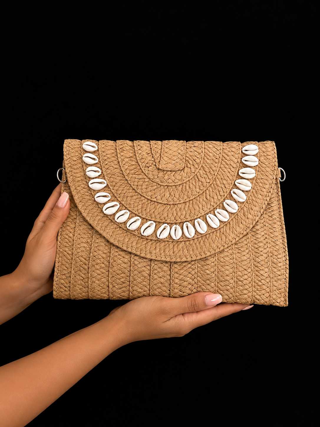 82414591-F3B4-4490-9E5A-64F9FE6659D3 Woven Raffia Clutch with Cowrie Shells - Image 1